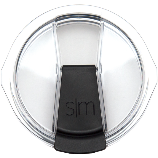 Transparent plastic or glass lid with black base component, product packaging detail shot.