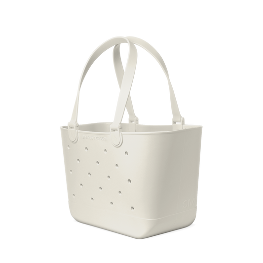 Cream-colored canvas tote bag with handles, displayed against a white background.