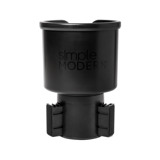 Black matte travel mug with front opening lid displayed against white background