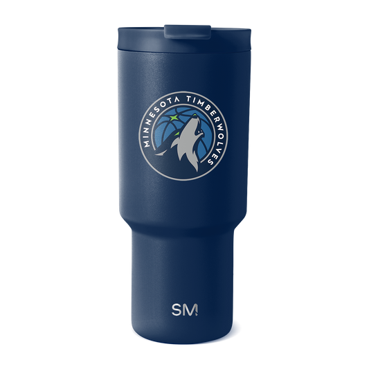 Deep navy blue insulated tumbler with matte finish featuring white and light gray team logo and branding, accent colors visible on surface.
