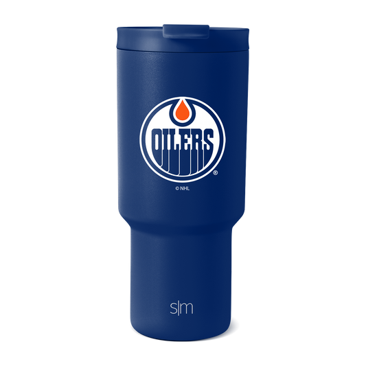 Royal blue insulated tumbler with white accents and integrated lid, shown against white background.