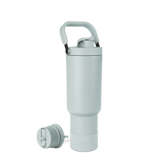 Soft sage green water bottle with black accents and carrying handle
