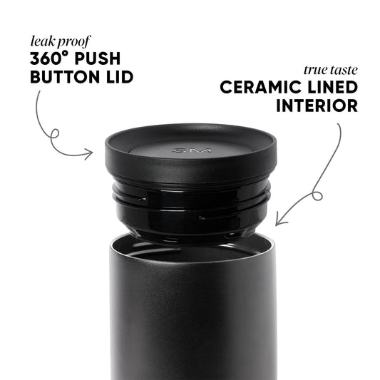 Matte black smartwatch with removable components and charcoal gray background