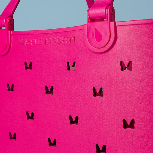 Vibrant hot pink and magenta background with muted blue-gray tones in upper portion, creating bold color contrast