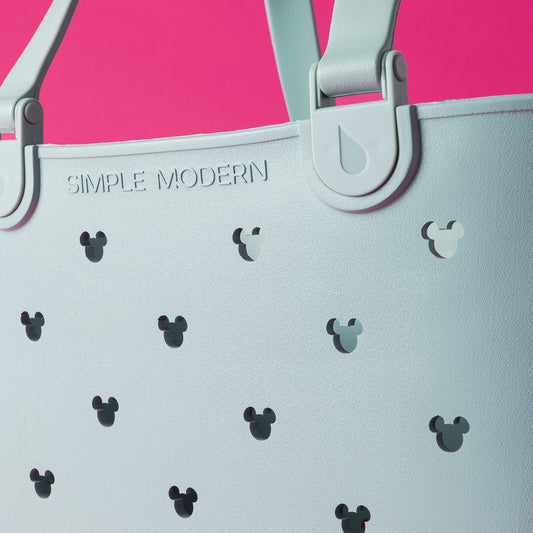 Light mint green tote bag on hot pink background