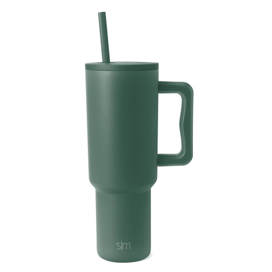 Sage green Trek Tumbler with matching handle and straw on white background