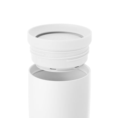 White translucent 360-degree rotating lid with soft gray shadows on neutral off-white background, minimalist product design emphasizing clean aesthetic and depth.