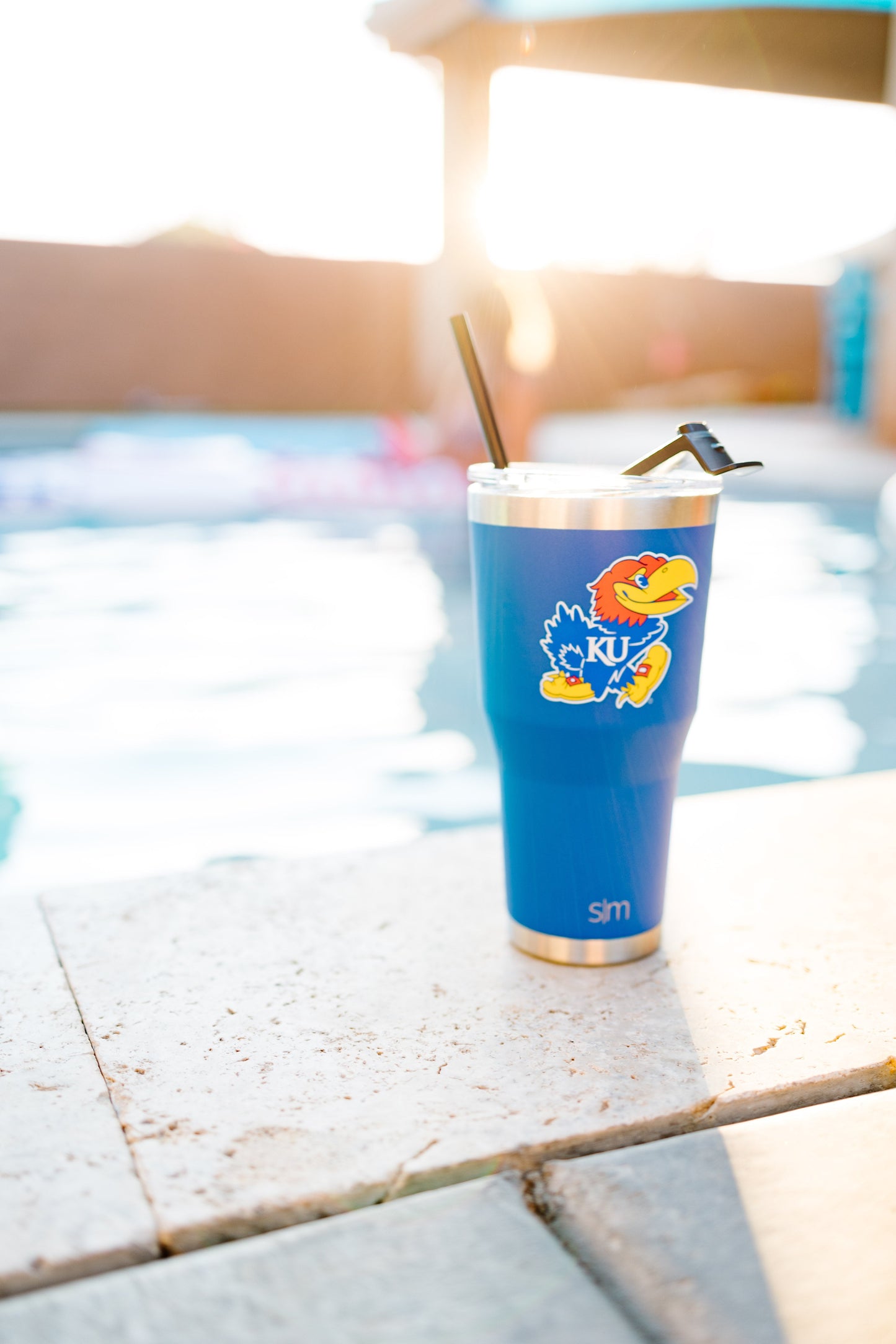 Bright cobalt blue insulated tumbler with brushed metallic gold accents
