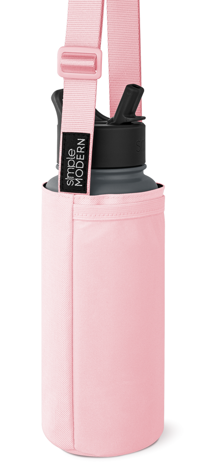 Soft pink cylindrical carrying case with charcoal gray and black accents, featuring a matching shoulder strap with webbing texture.