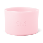 Soft pale pink cylindrical container with smooth sides and open rim, minimalist design
