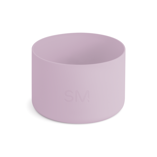 Mauve and lavender pink cylindrical boot or container on off-white background
