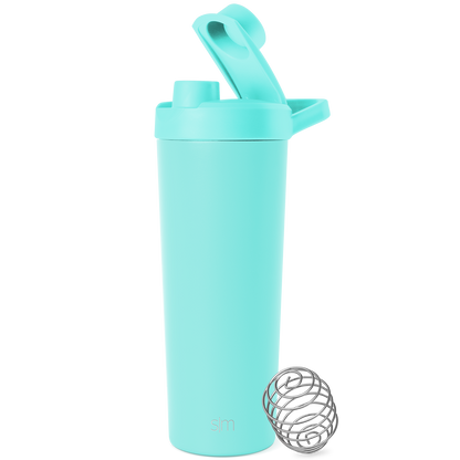 Soft pale turquoise container with stainless steel silver-gray mixing ball on white background