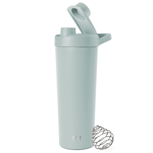 Sage green water bottle with stainless steel lid and wire mixing ball