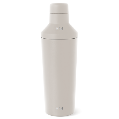 Cream-colored cosmetic bottle with minimalist design displayed against a white background