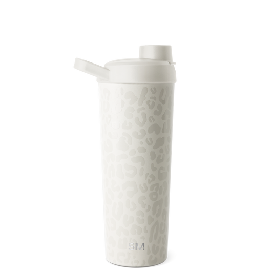 White insulated tumbler with lid displayed against a neutral background