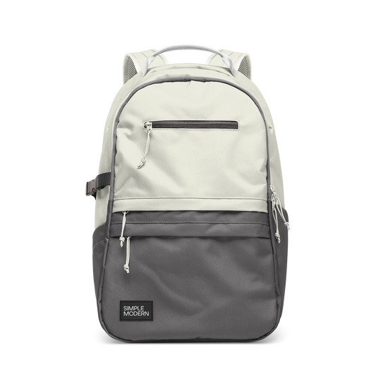 Cream and charcoal gray two-tone backpack with gray accent straps and piping trim along the edges where the colors meet.