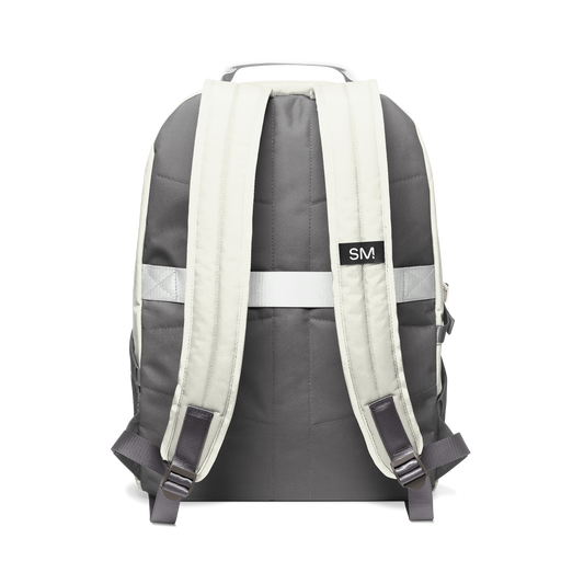 Cream and dark color-block backpack rear view showing padded shoulder straps and upper back panel