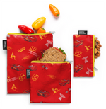 Red fabric with yellow zippers and yellow accents, featuring peppers and almonds pattern