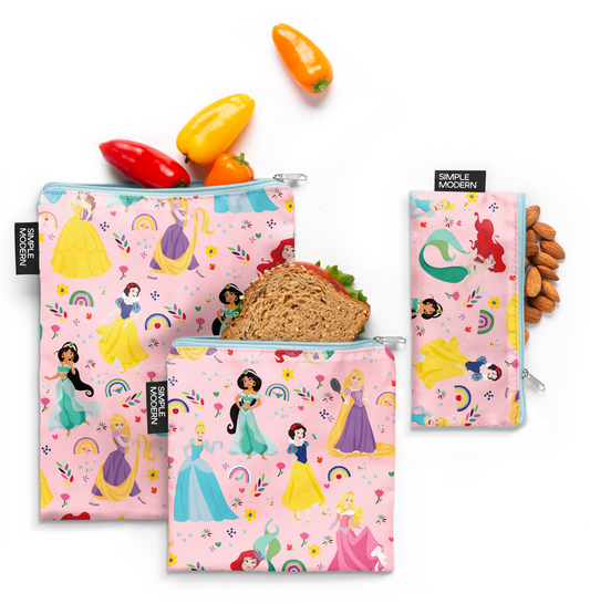 Three pouches with soft pink backgrounds and vibrant teal, yellow, purple, red, orange, and green accents displayed side by side.