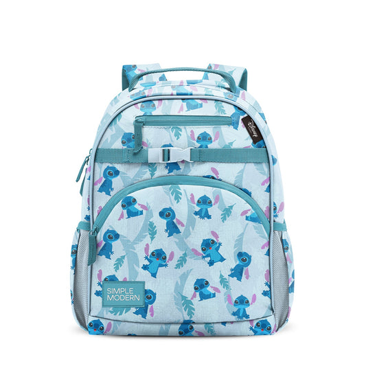 Light blue children's backpack with teal handles and straps, featuring an all-over pattern of blue cartoon alien characters with pink wings and teal leaves. Front zippered pocket, side mesh panels, and Simple Modern brand