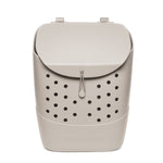 Beige cream-colored product with black circular perforations throughout, creating monochromatic design with contrast detailing
