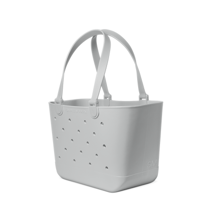 Light gray ice maker with white background, featuring monochromatic soft gray and white tones in minimalist product design.