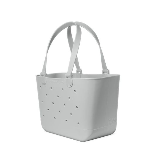Light gray ice maker with white background, featuring monochromatic soft gray and white tones in minimalist product design.