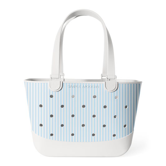 Light blue and white striped tote bag with white handles, metal grommets across the front, and "SIMPLE MODERN" branding, photographed against a white background.