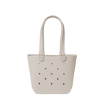 Soft beige canvas tote bag displayed against a light gray-white background