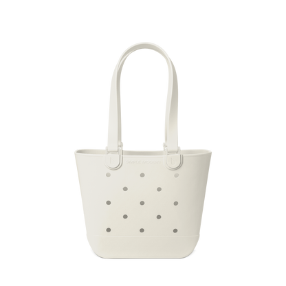 Cream-colored canvas tote bag with gray perforated details against a white background