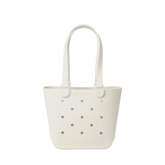 Cream-colored canvas tote bag with gray perforated details against a white background