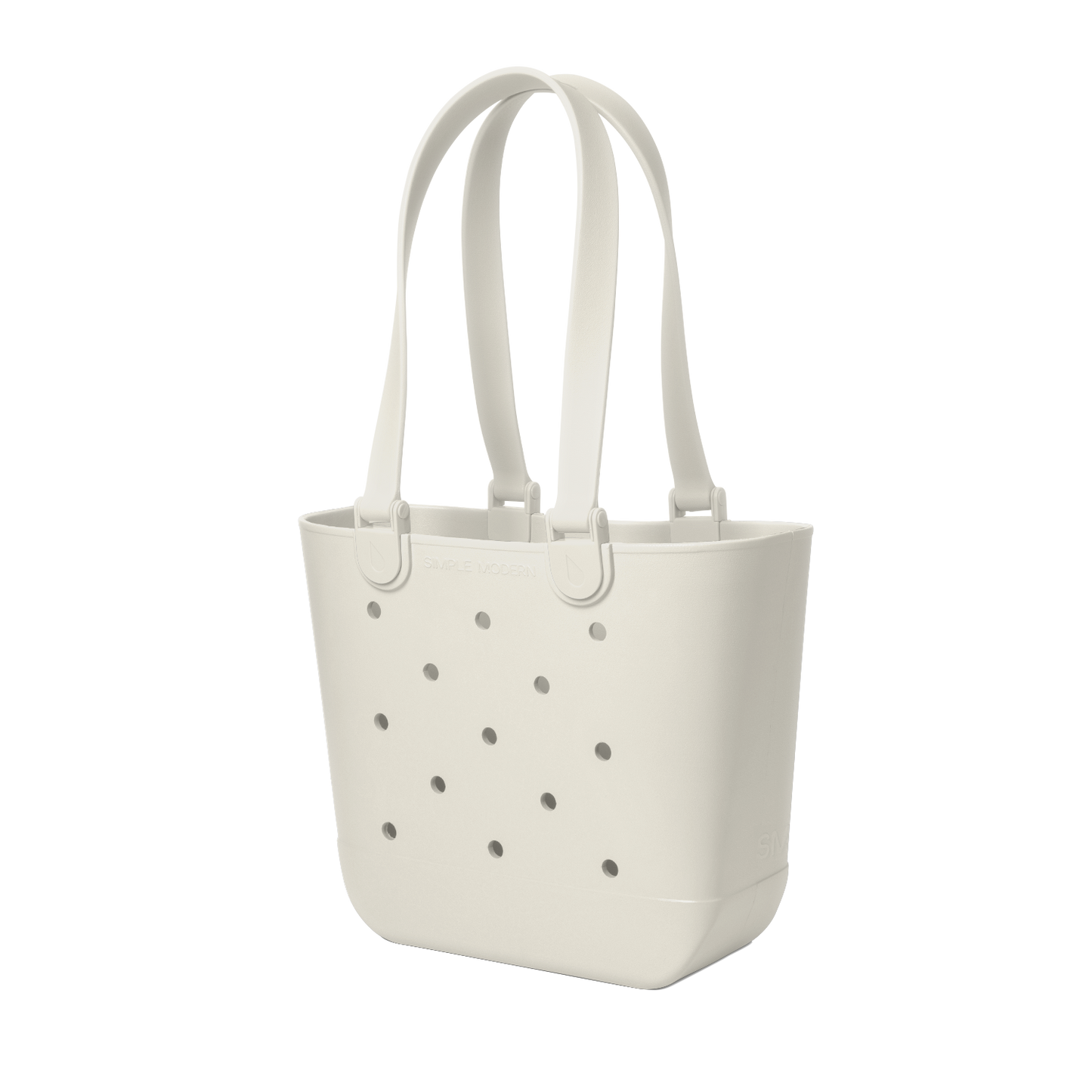 Off-white cream canvas tote bag with scattered gray circular perforations across the front surface