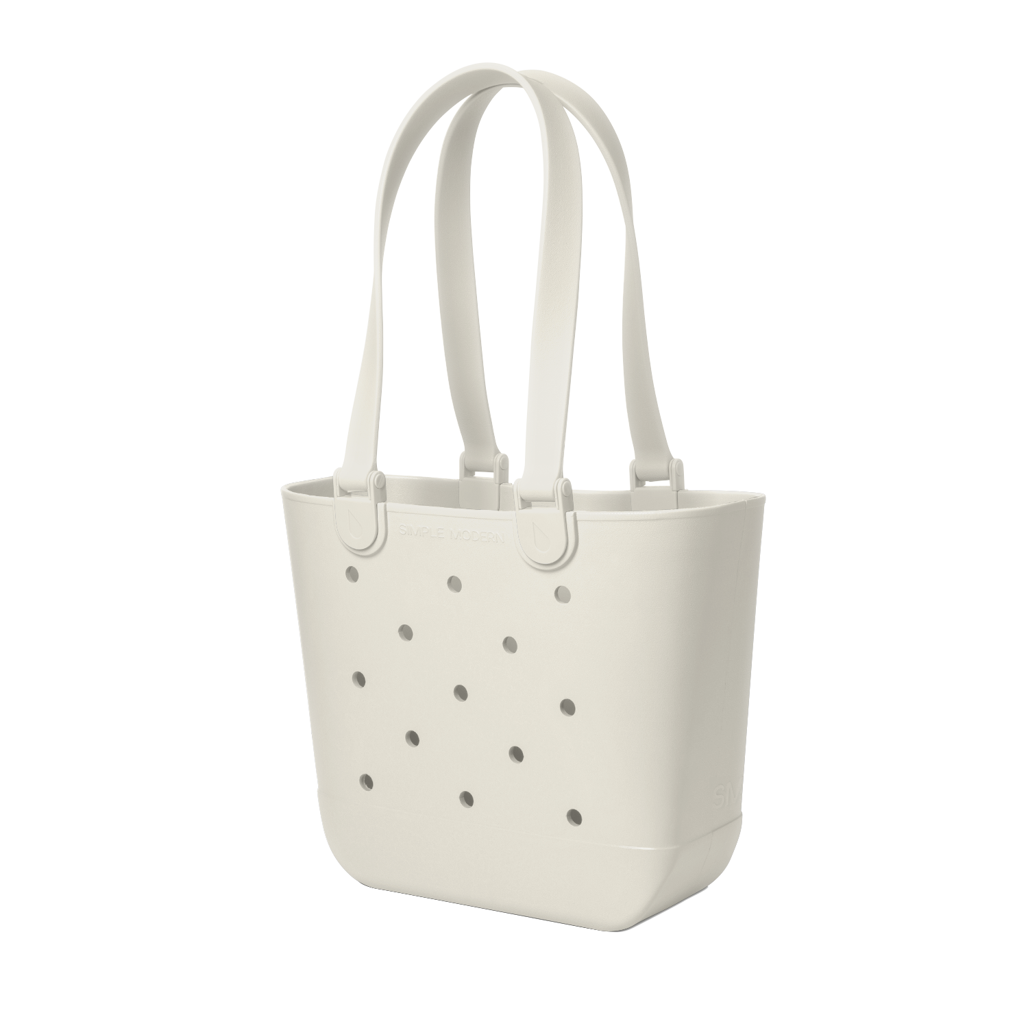 Off-white cream canvas tote bag with scattered gray circular perforations across the front surface