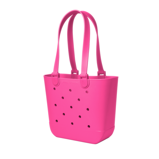 Vibrant hot pink canvas tote bag with handles against white background
