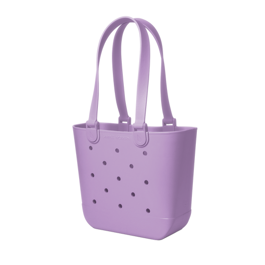 Soft lavender purple tote bag with deeper purple perforated details across the front