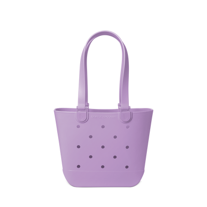 Soft lavender purple tote bag with decorative perforations in darker purple and gray tones on the front panel.