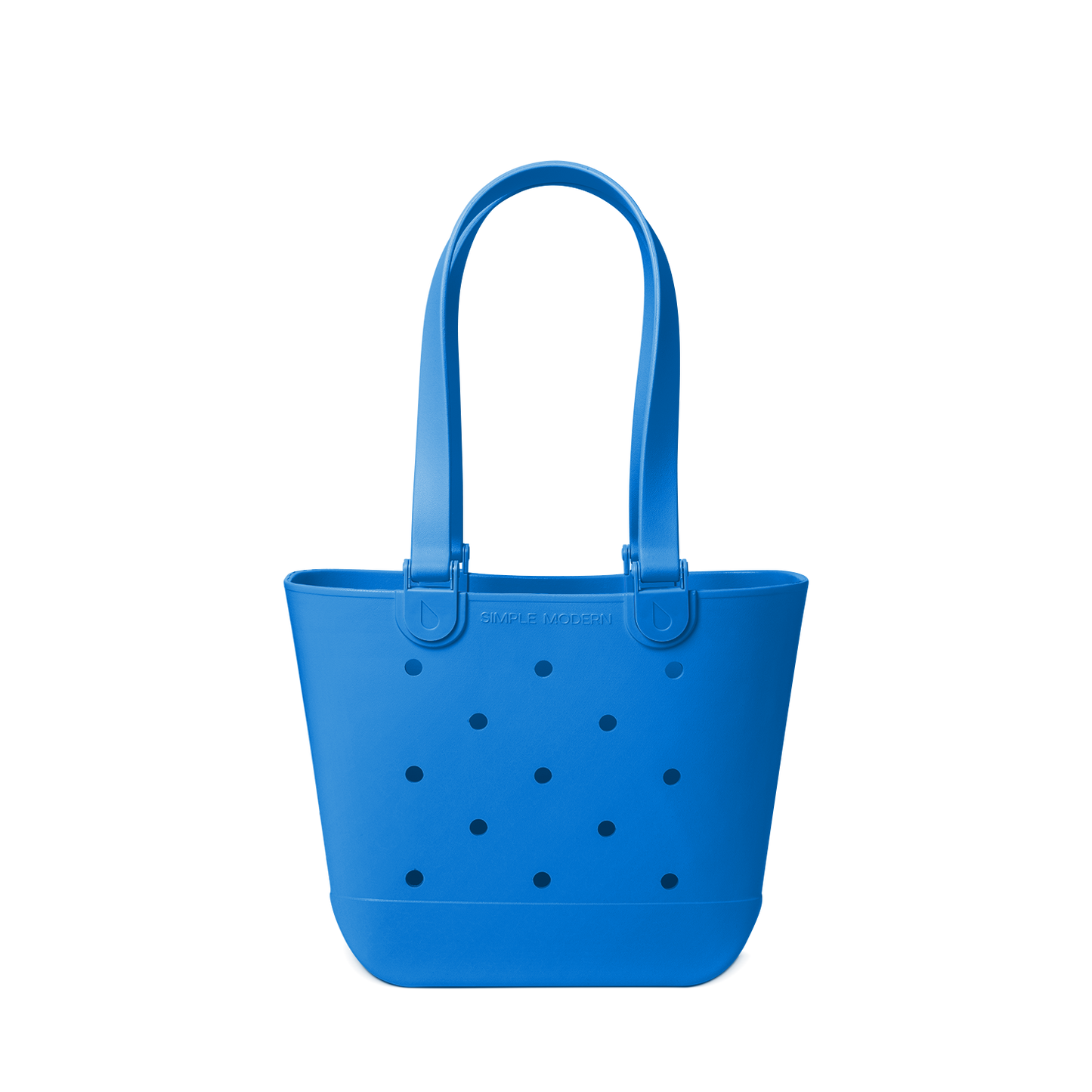 Royal blue tote bag with navy polka dots on off-white background
