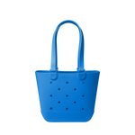 Royal blue tote bag with navy polka dots on off-white background