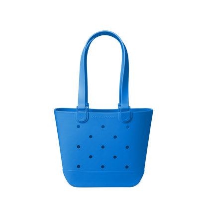 Royal blue tote bag with navy polka dots on off-white background