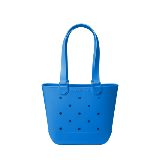 Royal blue tote bag with navy polka dots on off-white background
