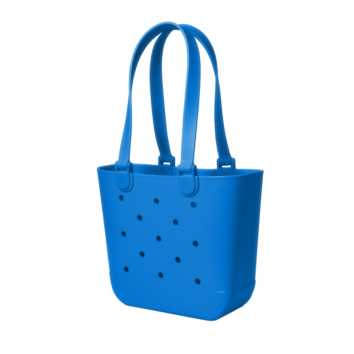 Blue tote bag with perforated details, viewed from the front. The bag features a solid royal blue color with small holes throughout the design.