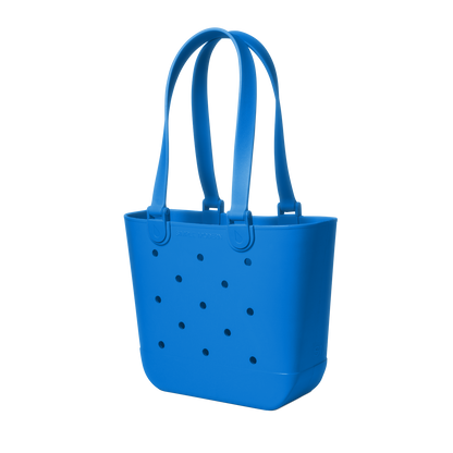 Blue tote bag with perforated details, viewed from the front. The bag features a solid royal blue color with small holes throughout the design.