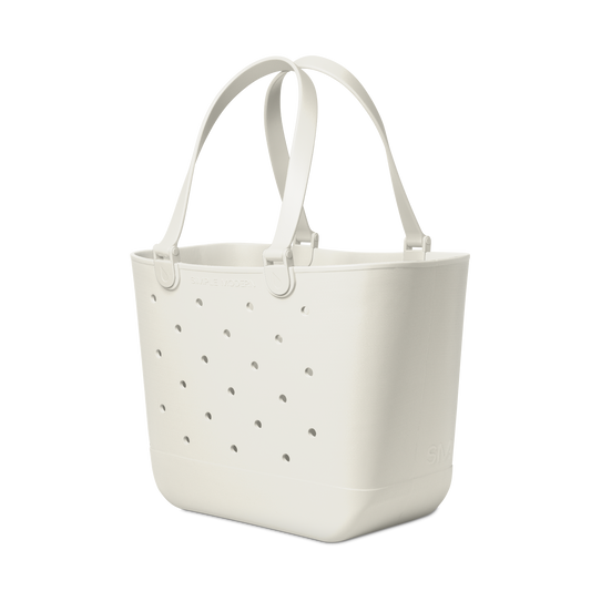 Cream-colored extra large tote bag with soft gray perforated details and subtle shadows, displayed against a white background.