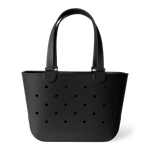 Matte black tote bag with perforated grid pattern and curved handles on white background. Features "Simple Modern" branding embossed on front. Studio product photography.