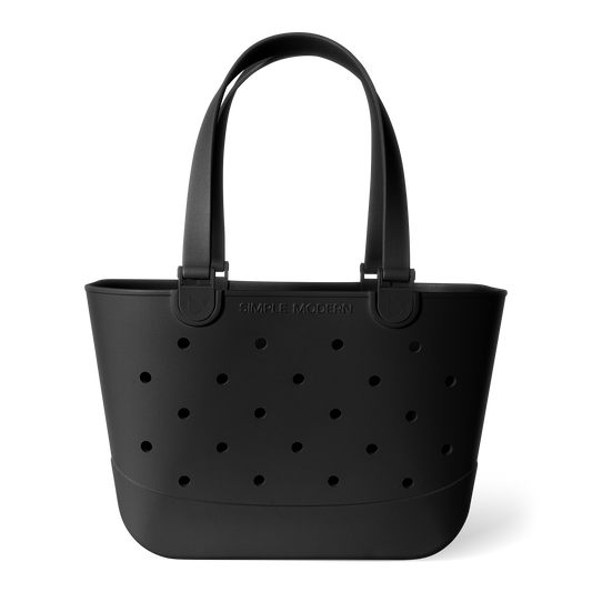 Matte black tote bag with perforated grid pattern and curved handles on white background. Features "Simple Modern" branding embossed on front. Studio product photography.