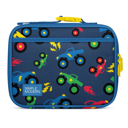Navy blue kids lunch box by Simple Modern with colorful toy truck and rocket pattern, yellow carry handle and zipper pull, padded soft-sided design for insulated food storage.