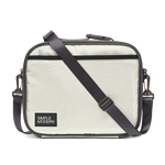 Light cream canvas tote bag with charcoal gray trim, black webbing straps, and dark hardware. Front view of structured handbag with contrasting accent details.