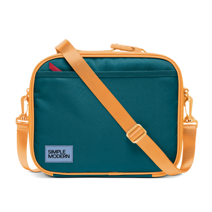 Deep teal canvas bag with apricot orange trim, piping, handles, and shoulder strap