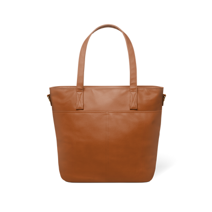 Back view of cognac brown leather tote bag in medium to dark tan shade, showing structured silhouette and craftsmanship details of this sophisticated, earthy-toned accessory.