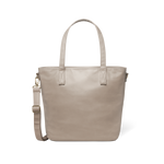Beige tote bag with metal hardware accents displayed against a white background